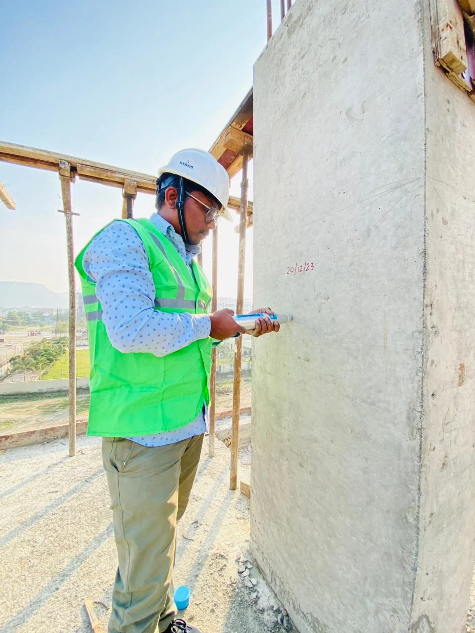 Technician performing non-destructive testing on concrete structure